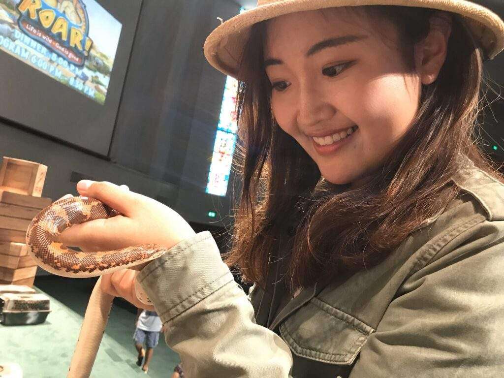 Yucong Chen visiting Mobile Zoo and holding a sand snake