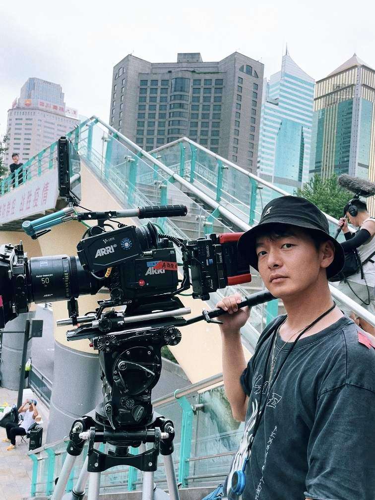 Yifu working on set