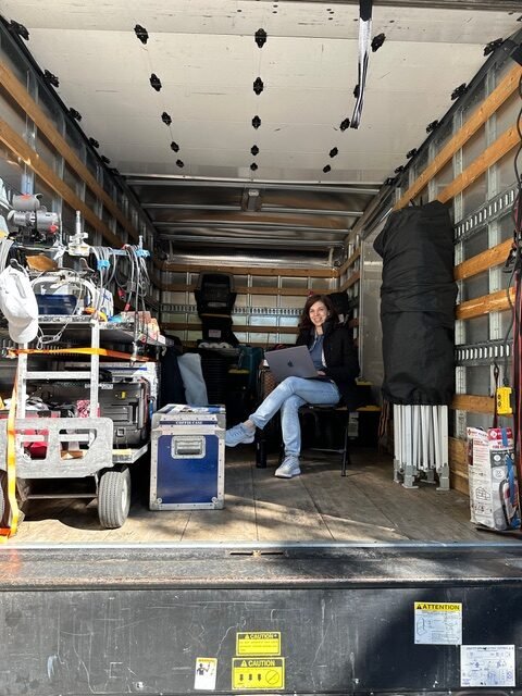 Slepneva takes a moment on set.